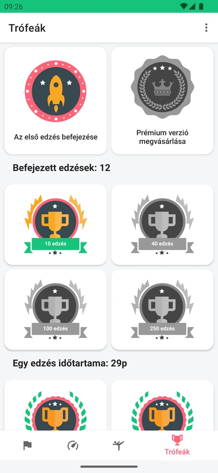 Az alkalmazás Trófeák képernyője: díjak a befejezett edzések számáért és az edzések időtartamáért.